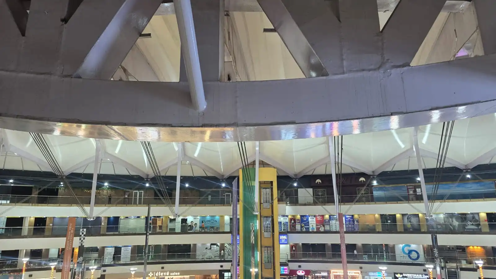Vasant Square Mall Vasant Kunj — panoramic view of the tensioned fabric roof over the full width of the escalator court, Ekra Decor